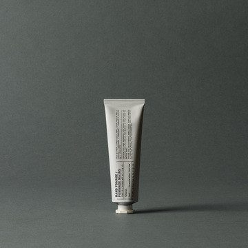 Le Labo hand pomade metal tube on a plain background