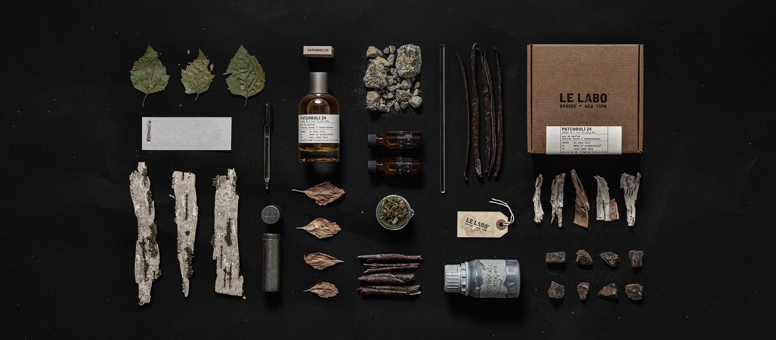 Le Labo Patchouli 24 eau de parfum bottle with patchouli leaves and birch tar