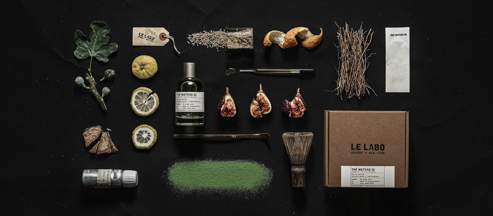 Le Labo Thé Matcha 26 eau de parfum bottle with matcha powder and green tea leaves