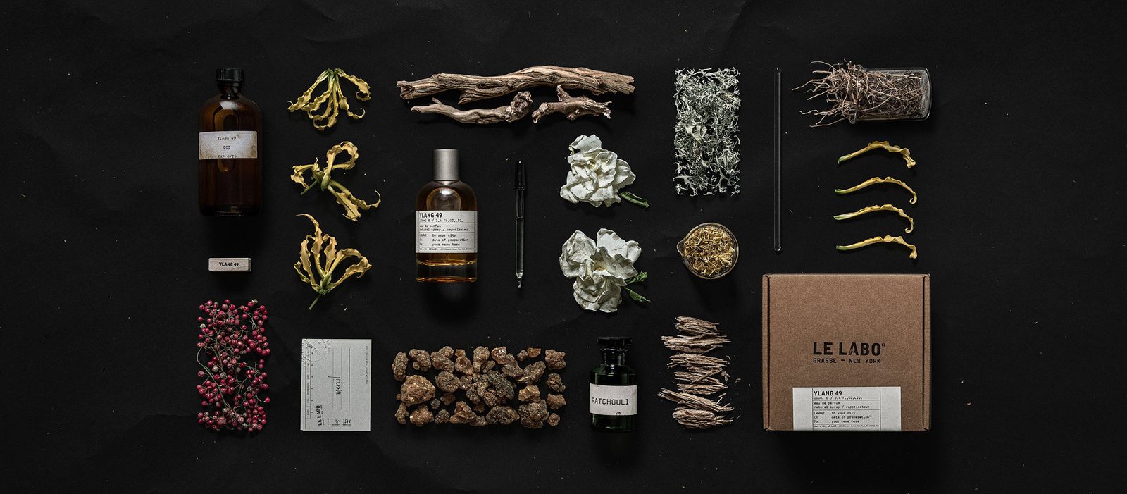 Le Labo Ylang 49 eau de parfum bottle with ylang-ylang flowers and oakmoss